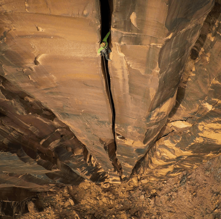 Man climbing cliff