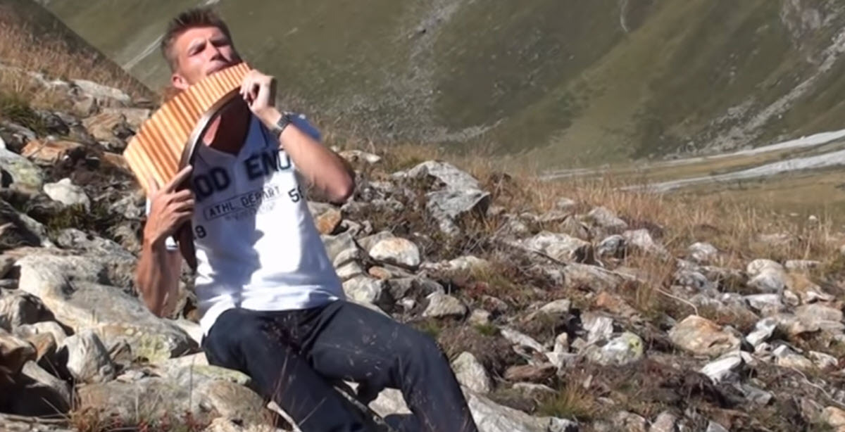 A Surreal Pan Flute Performance of 'Amazing Grace' Set Against the