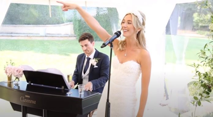 bride-groom-perform-thank-you-song-wedding-guests-jamie-megan-featured-image