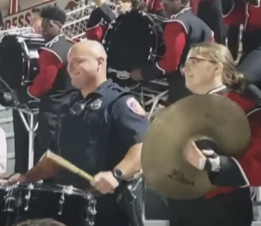 A Cop Steps in to Show His Drumming Talents With the High School Marching Band