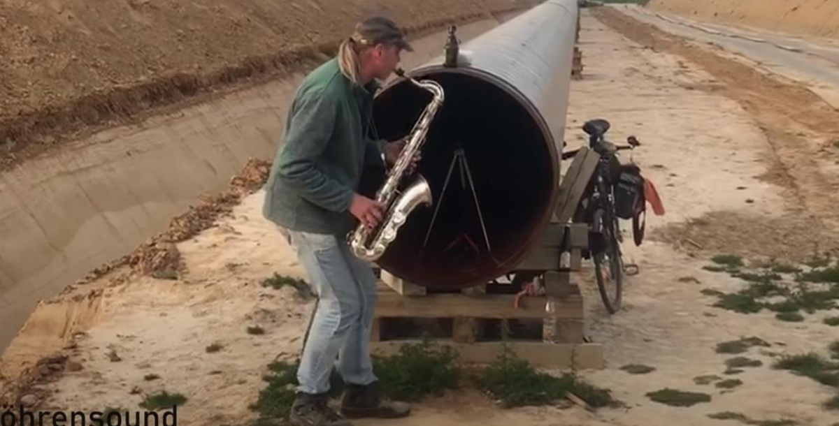 Guy Playing Saxophone Creates a Surreal Duet with Just the Echo from a