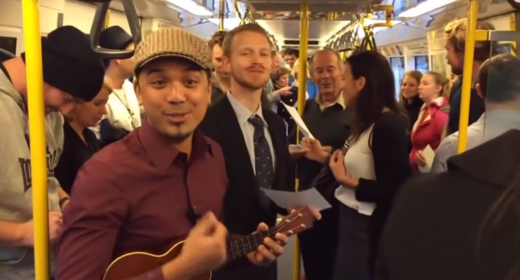 Train Passengers Sing Over the Rainbow