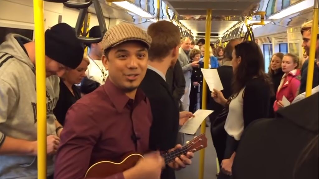 Train Passengers Sing Over the Rainbow
